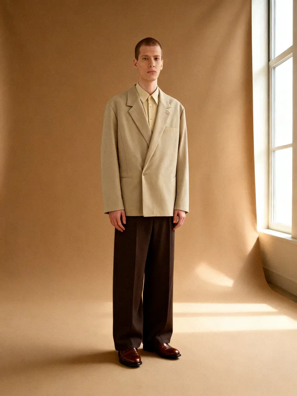 Tonal taupe tailoring, cream shirt, garden afternoon